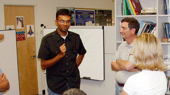 Dr. Ranga-Ram Chary addresses a group of teachers and students.