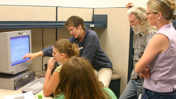 Scientists, students, and teachers work together on a Spitzer observation.