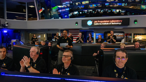 Spitzer Project Manager Joseph Hunt stands in Mission Control at NASA's Jet Propulsion Laboratory in Pasadena, California, on Jan. 30, 2020, declaring the spacecraft decommissioned and the Spitzer mission concluded.